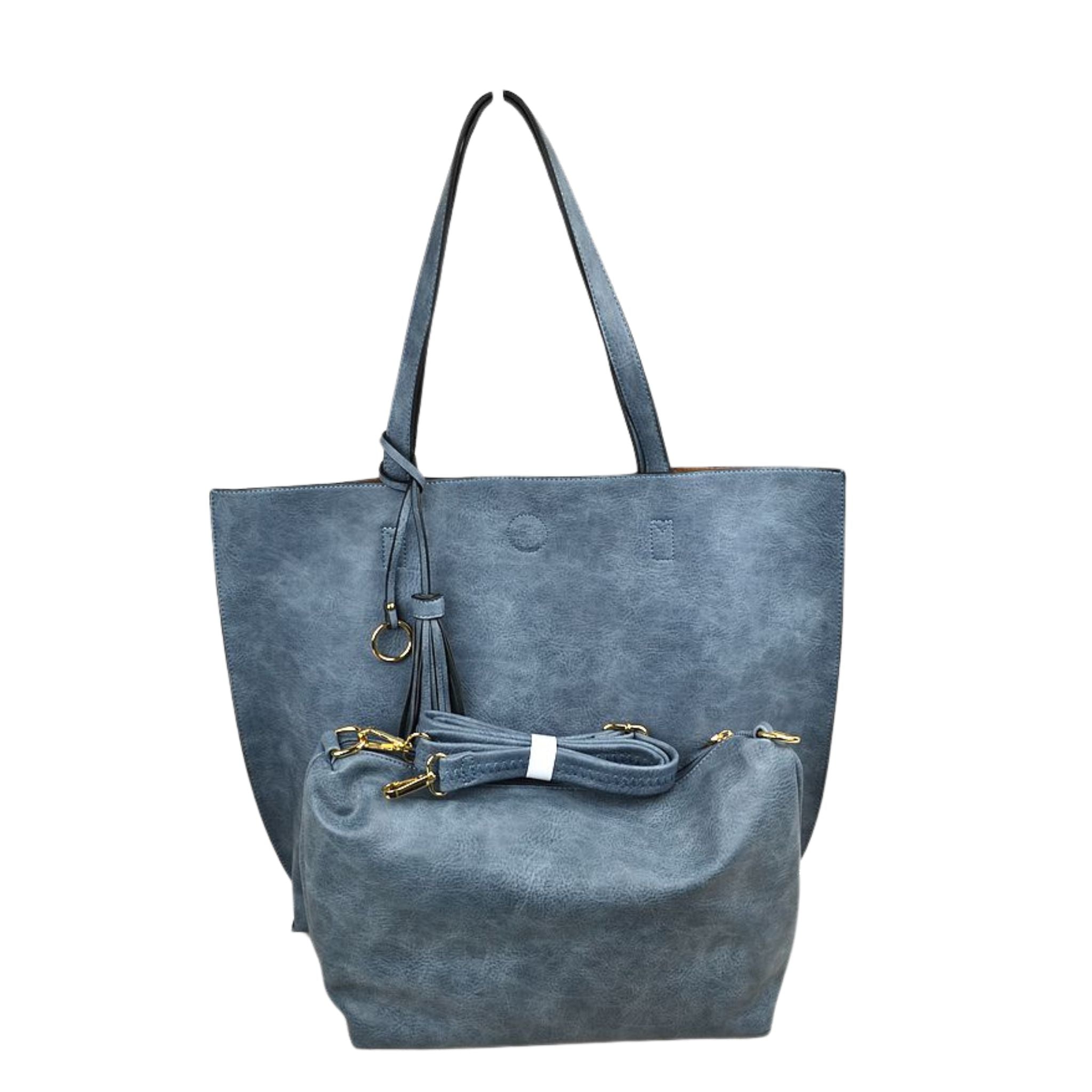Blue suede handbag with drawstring on a white background