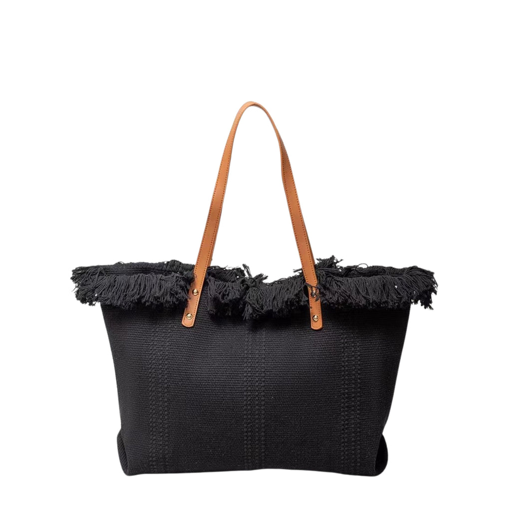 Black woven tote bag with frayed edges and brown leather straps on a white background