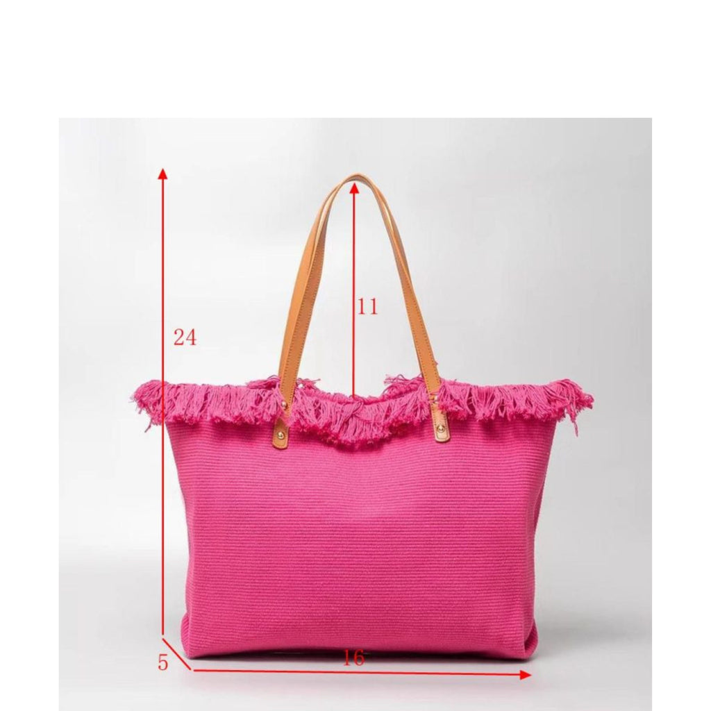 Pink tote bag with fringe details and measurements on a white background