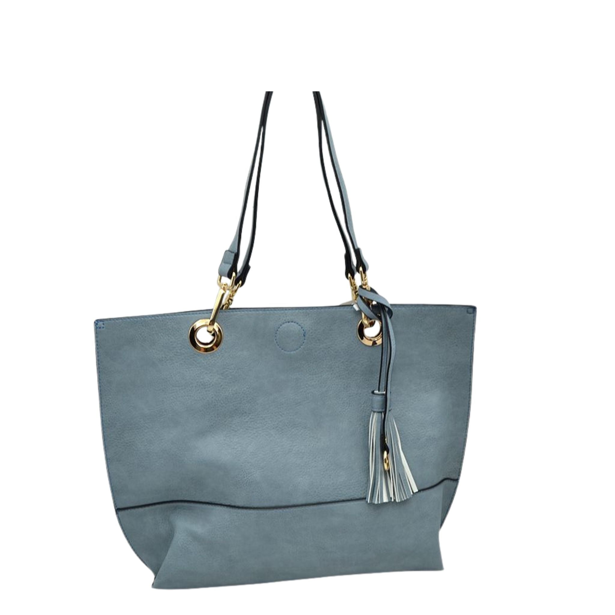 Gray handbag with gold accents and a tassel on a white background