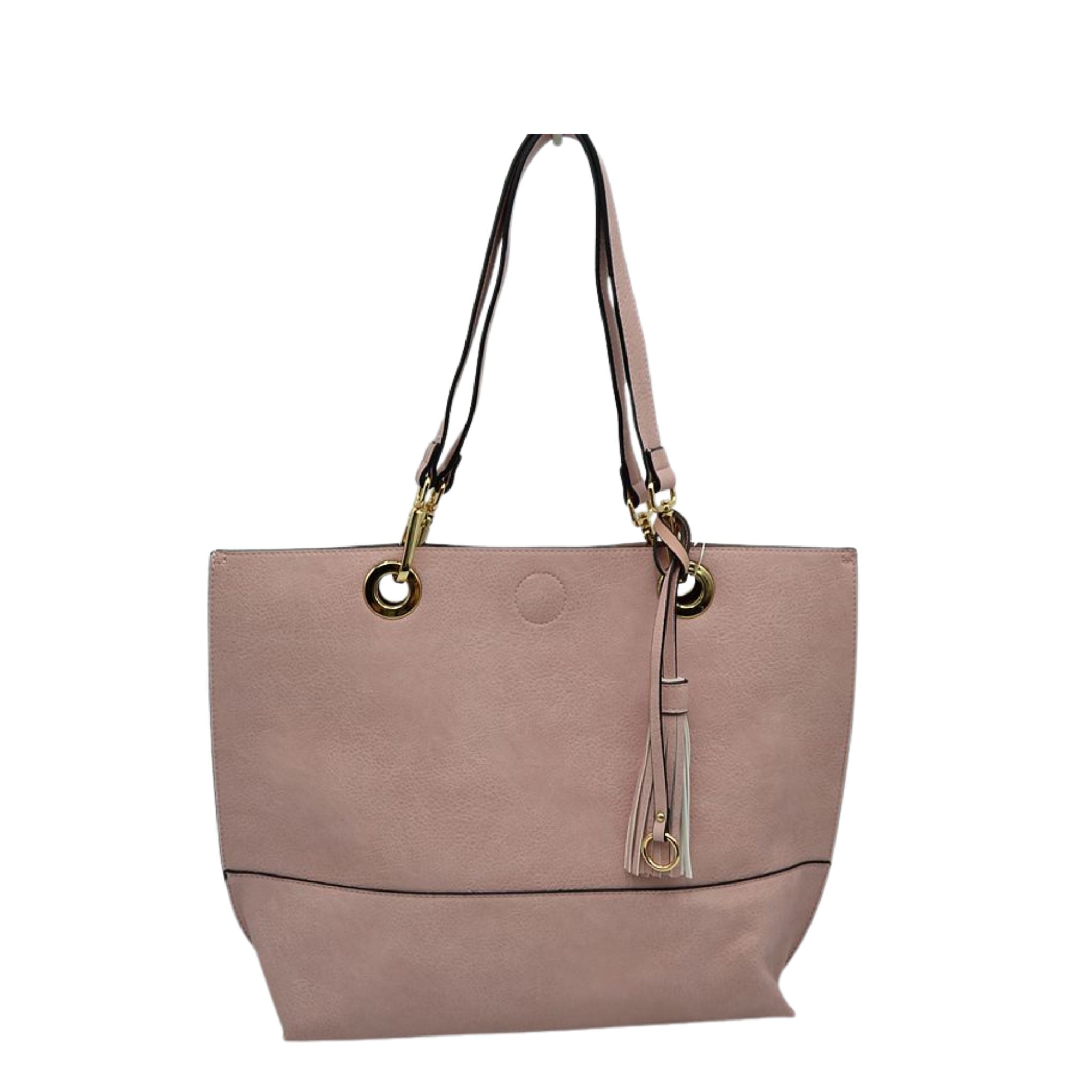 Pink handbag with gold accents on a white background
