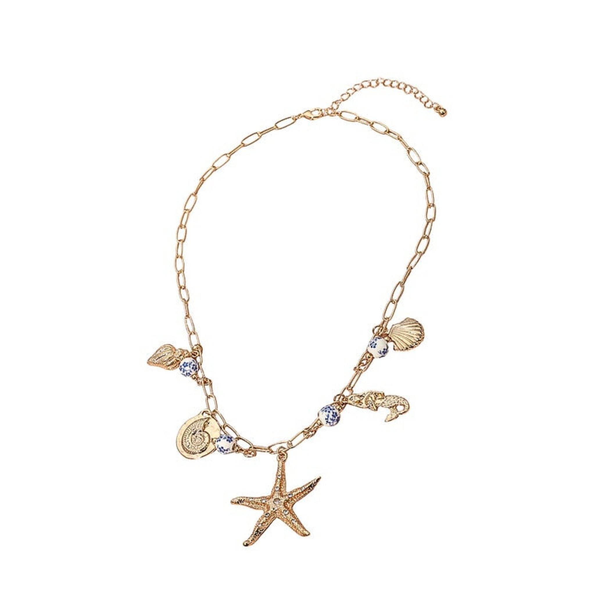Gold chain bracelet with starfish and shell charms on a white background