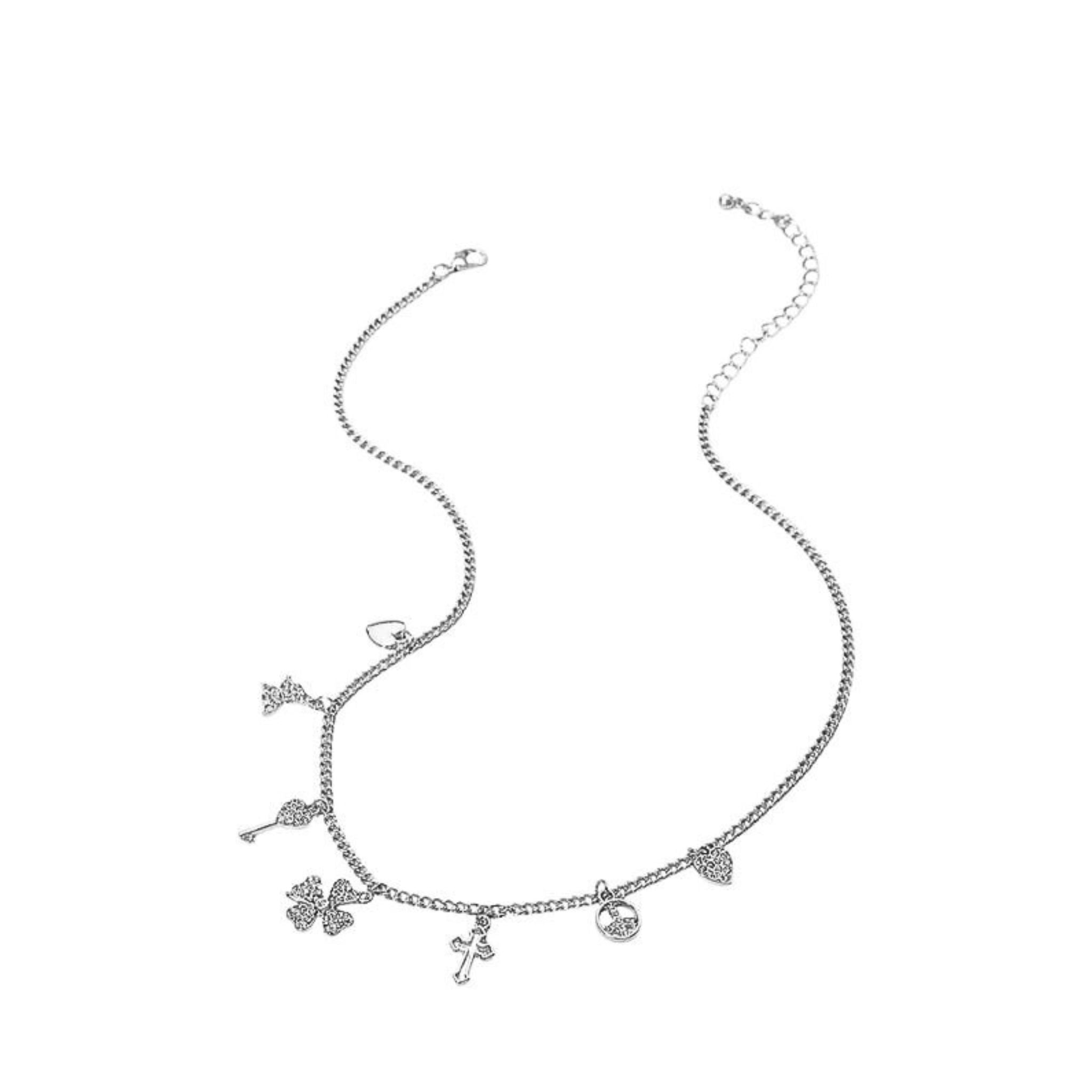 Silver necklace with various charms on a white background
