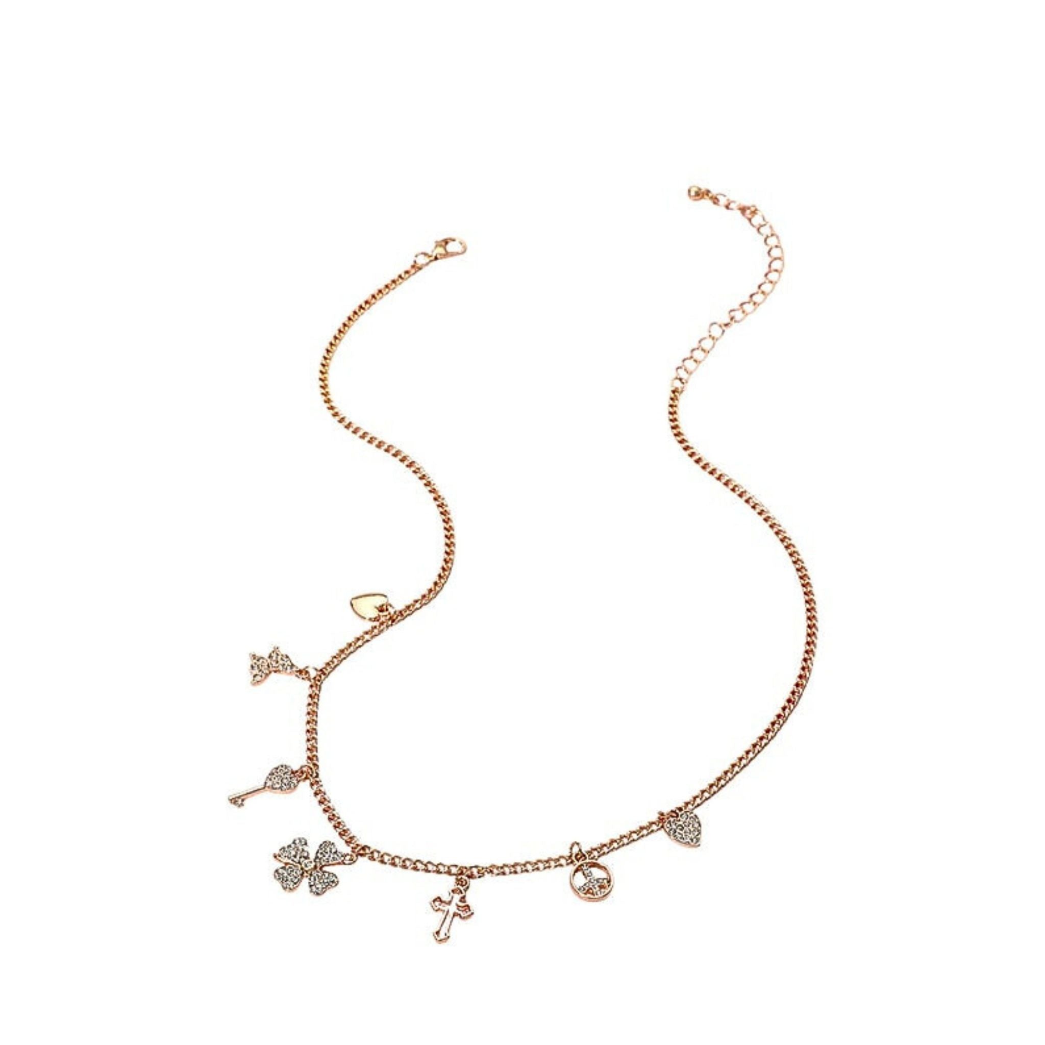 Gold necklace with charms on a white background