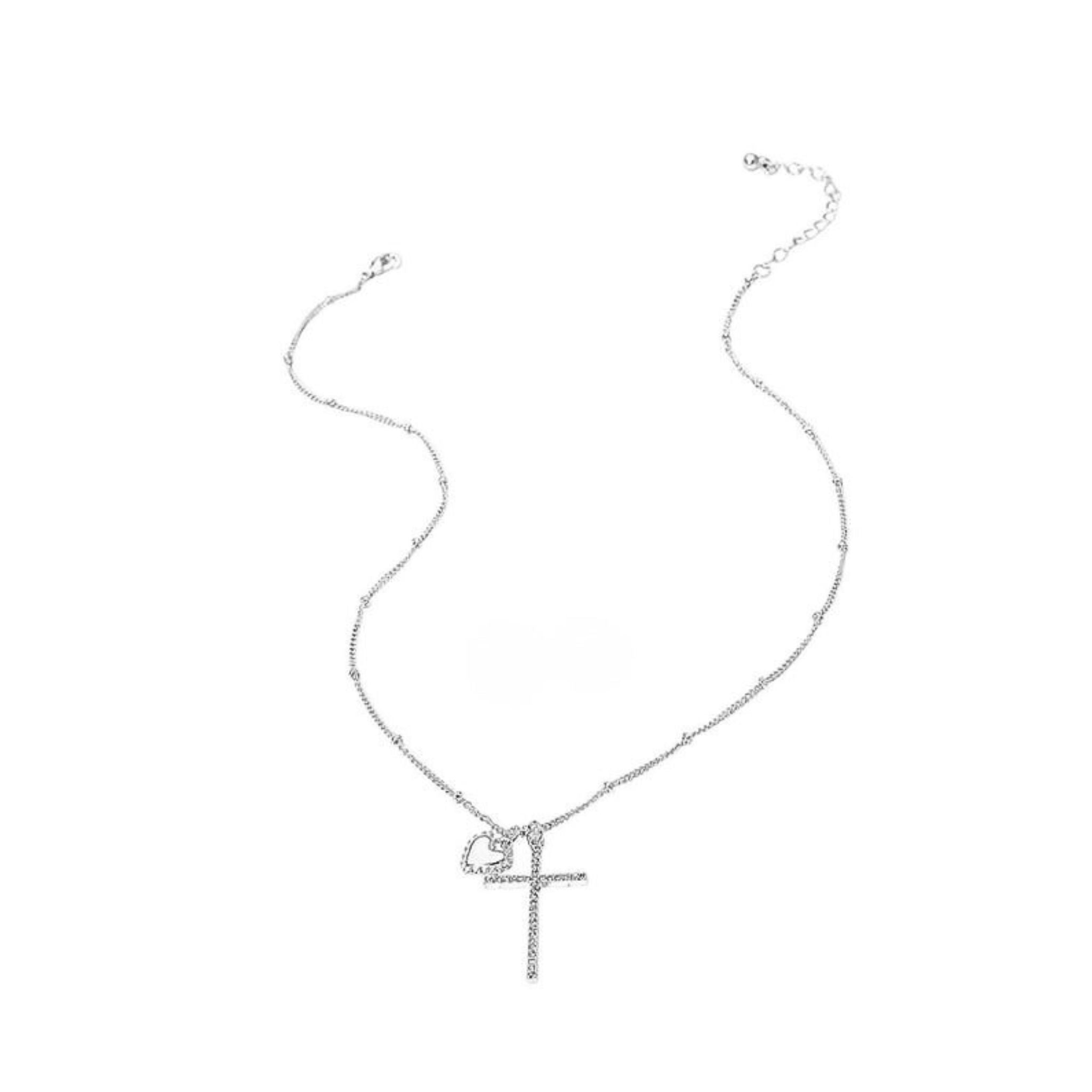 Silver necklace with a cross pendant on a white background