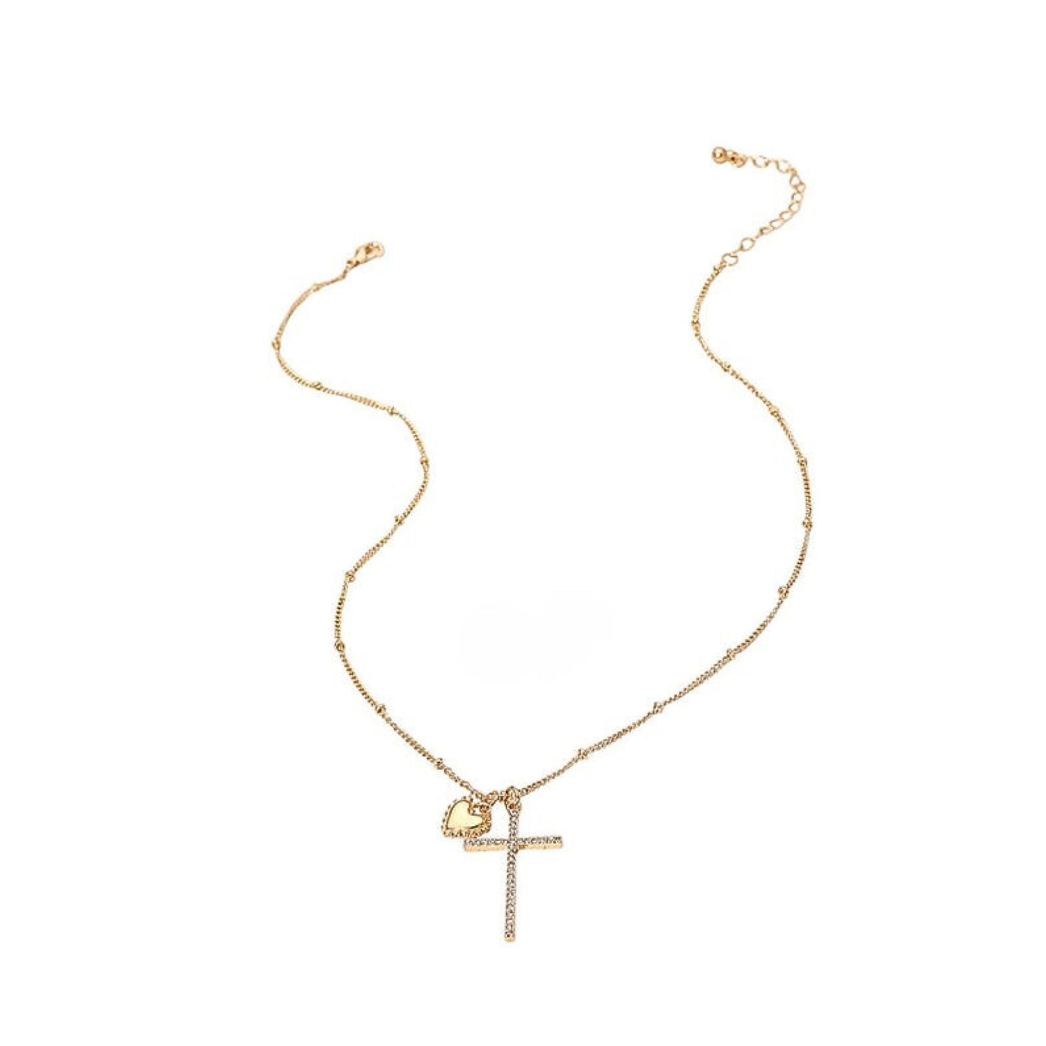 Gold necklace with a cross pendant on a white background