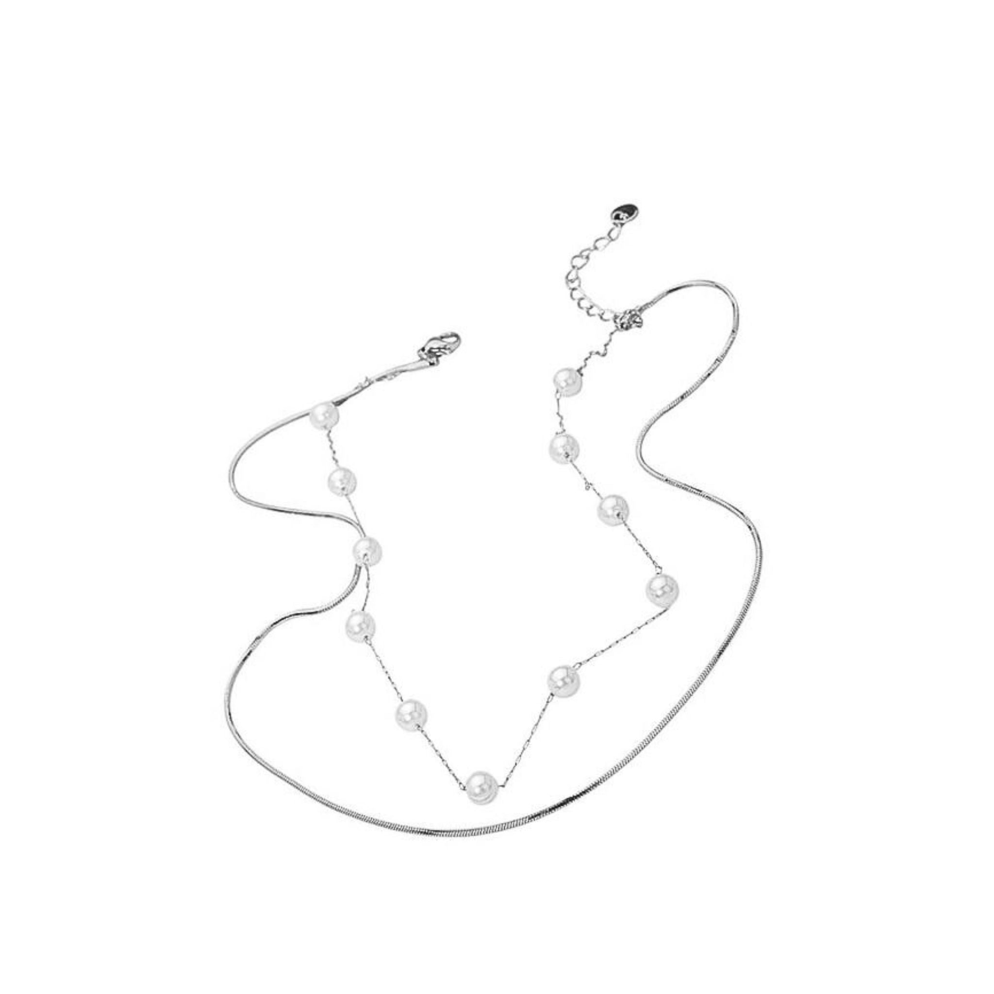 Silver necklace with pearls on a white background