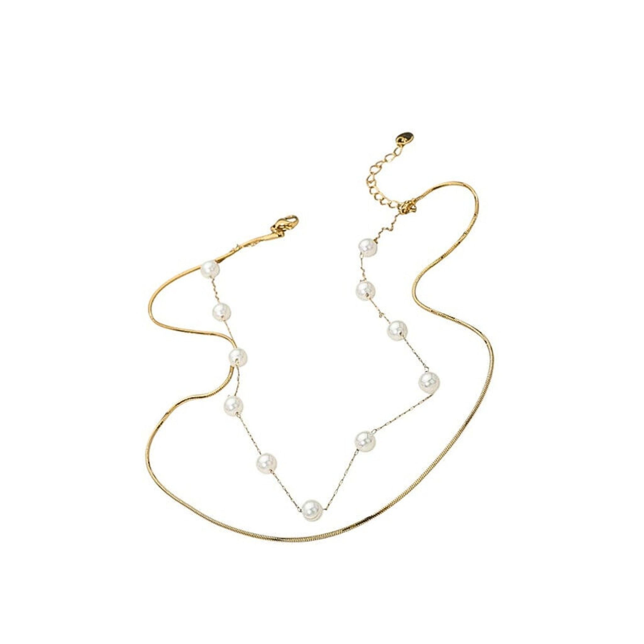 Gold necklace with pearl beads on a white background