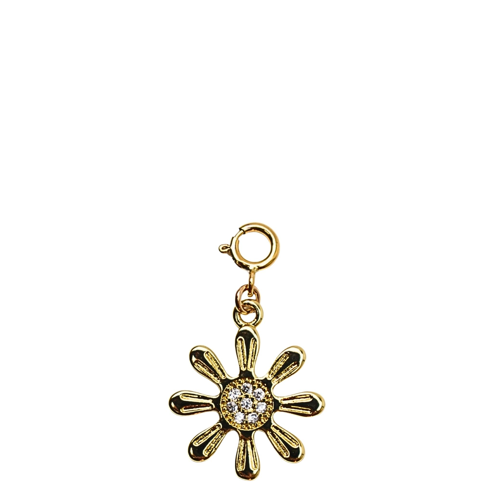Gold flower-shaped charm with a central gem on a white background