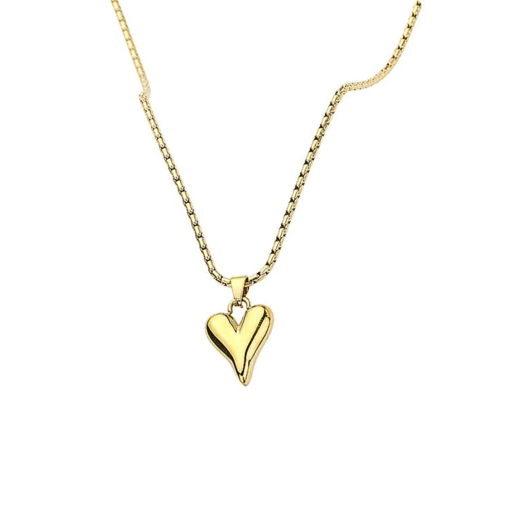Gold heart-shaped pendant necklace on a white background