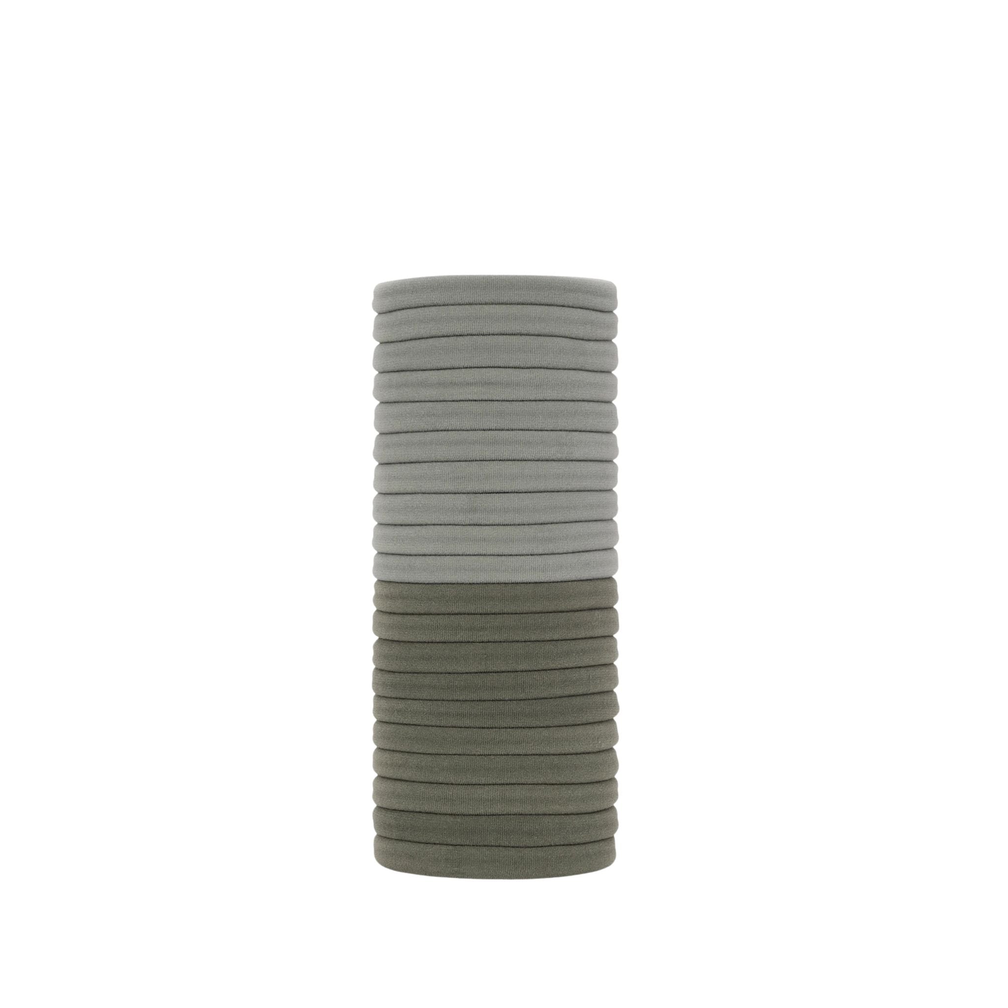 Stack of gray hair ties on a white background