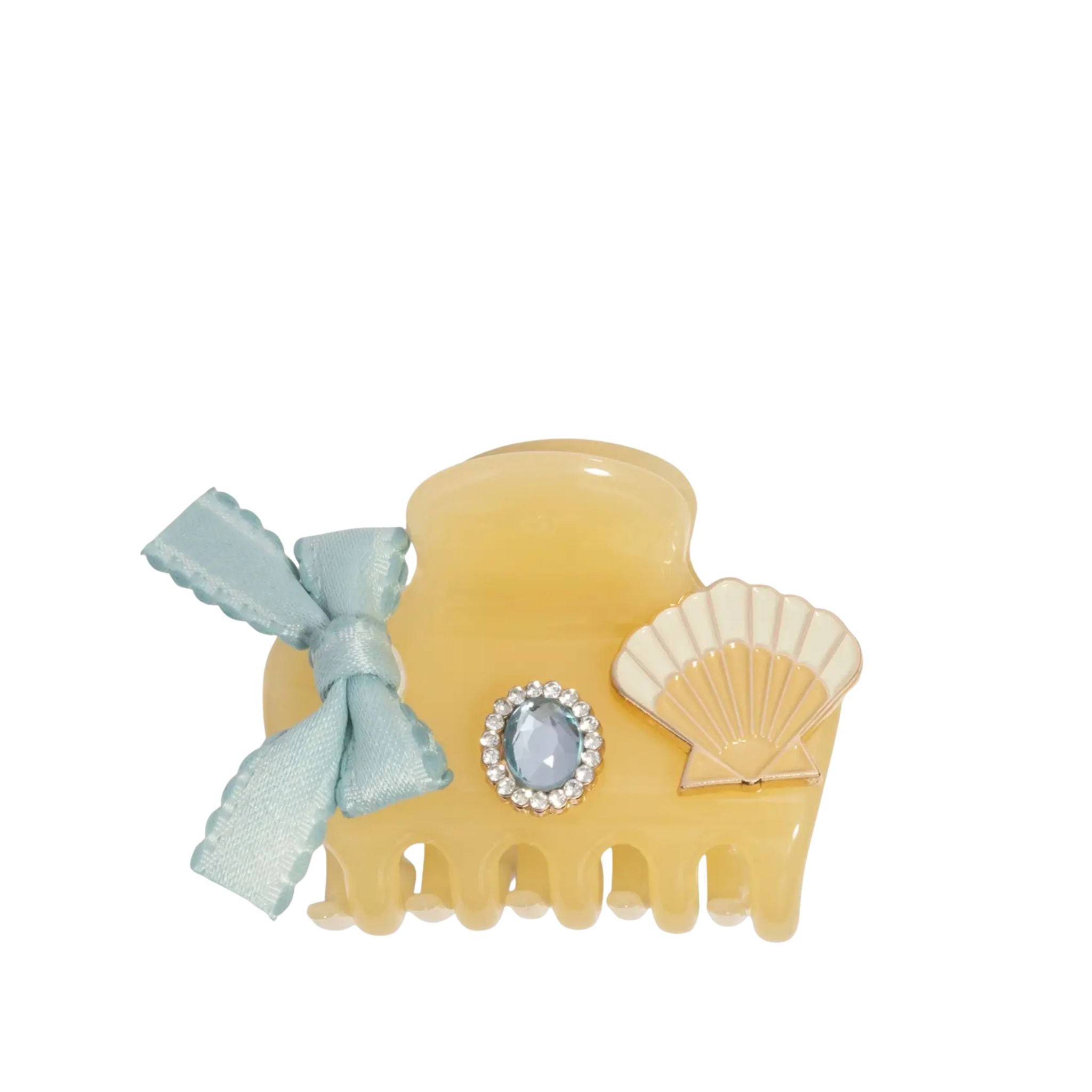 Hair clip with shell and bow design on a white background