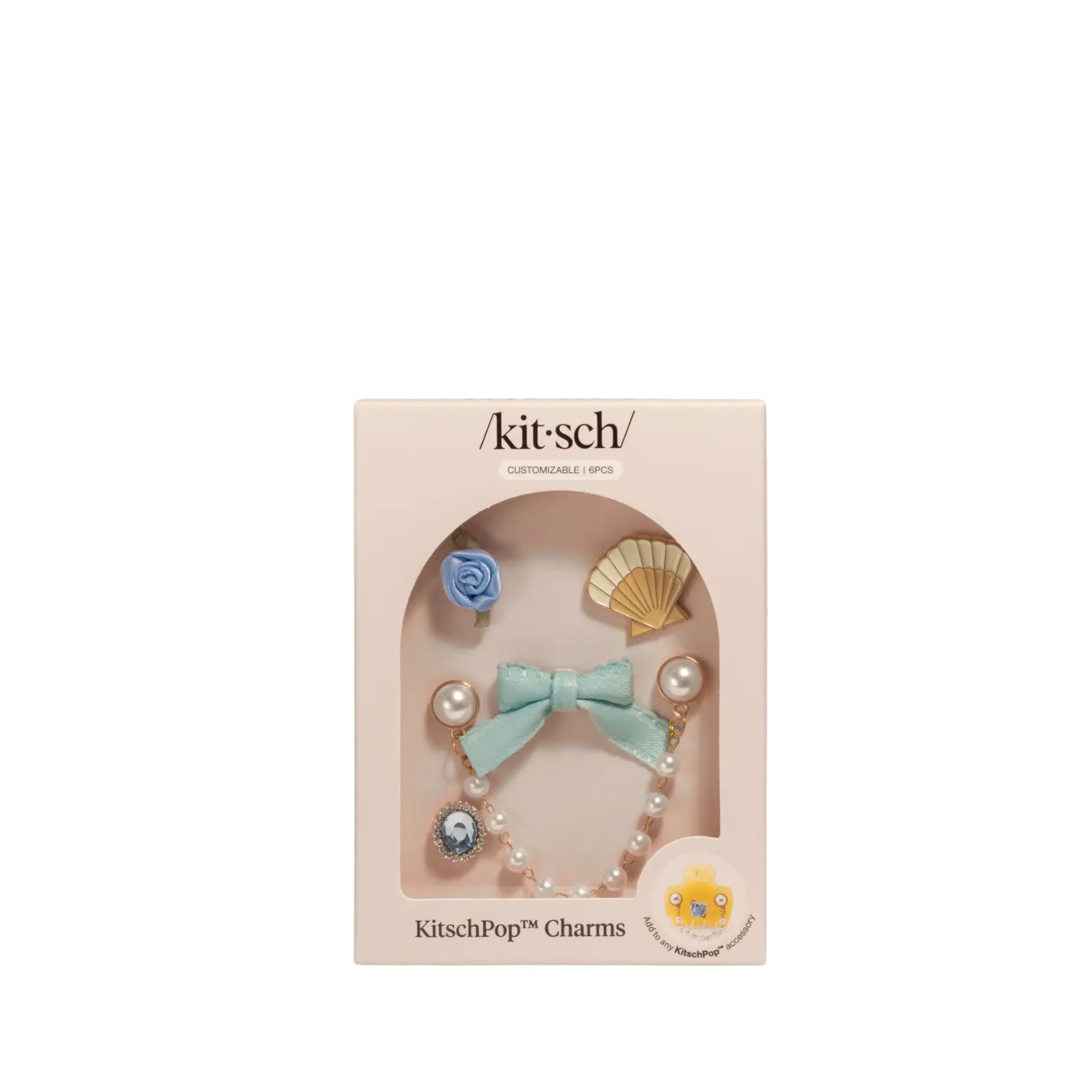 Kitsch charm set in packaging on a white background