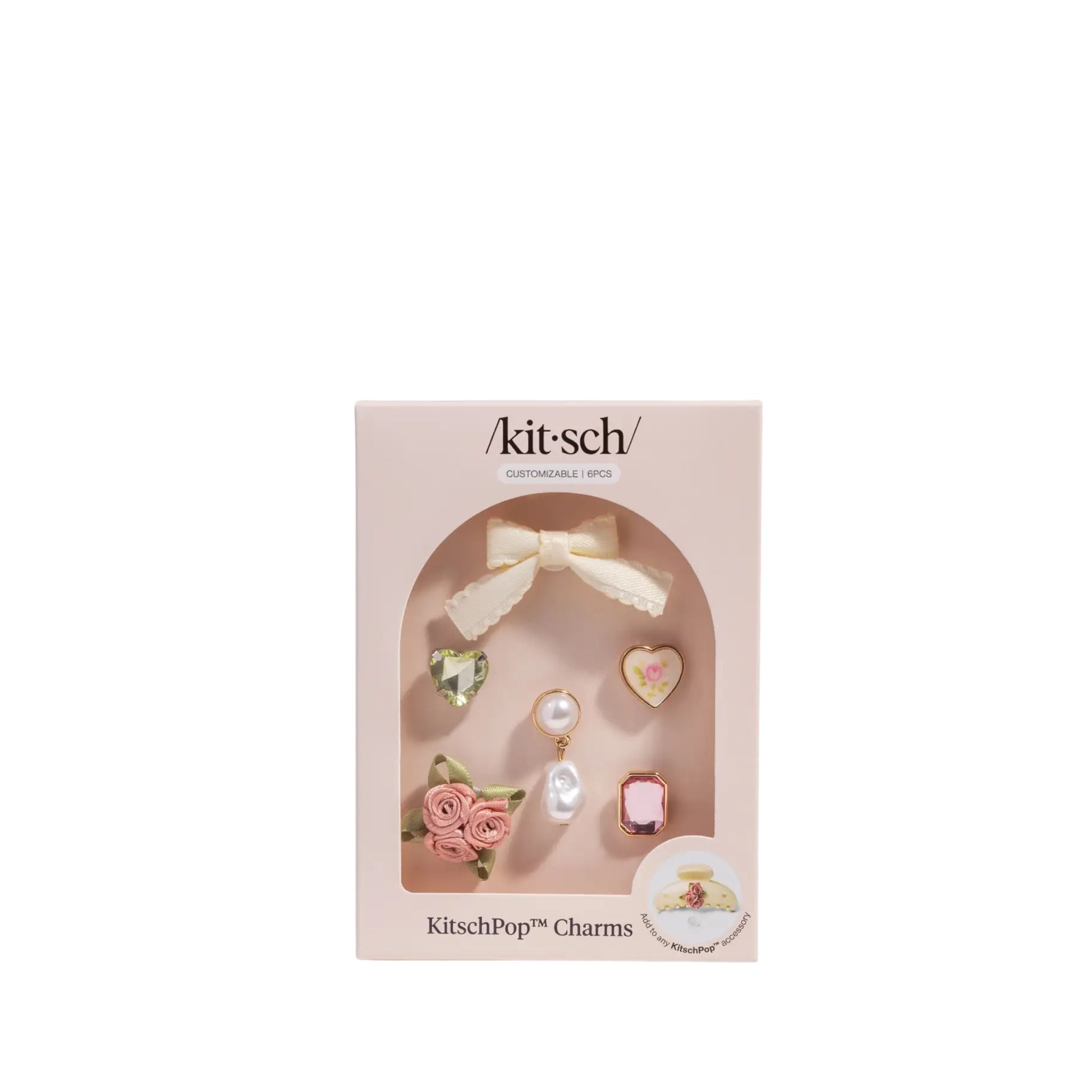 Kitsch charm set packaging with decorative charms on a white background