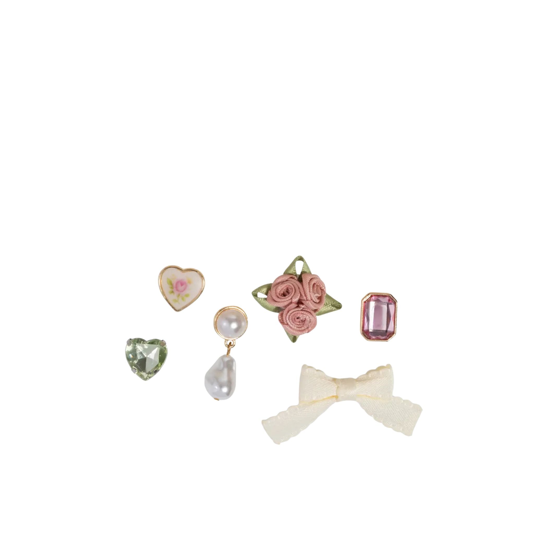 Set of decorative earrings on a white background