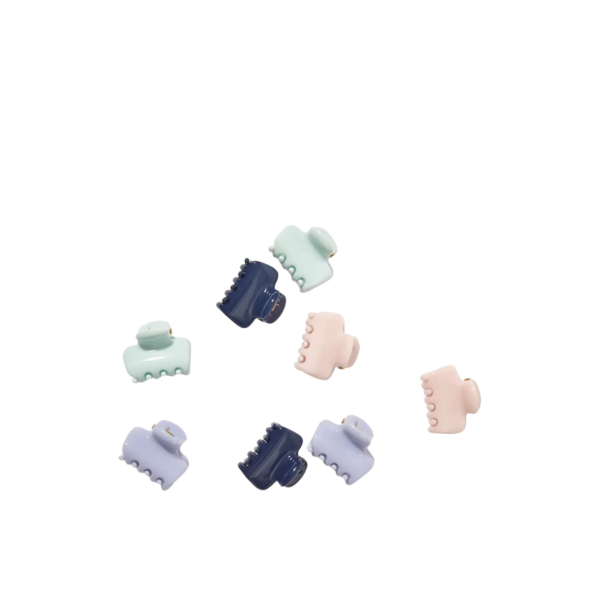 Set of colorful hair clips on a white background