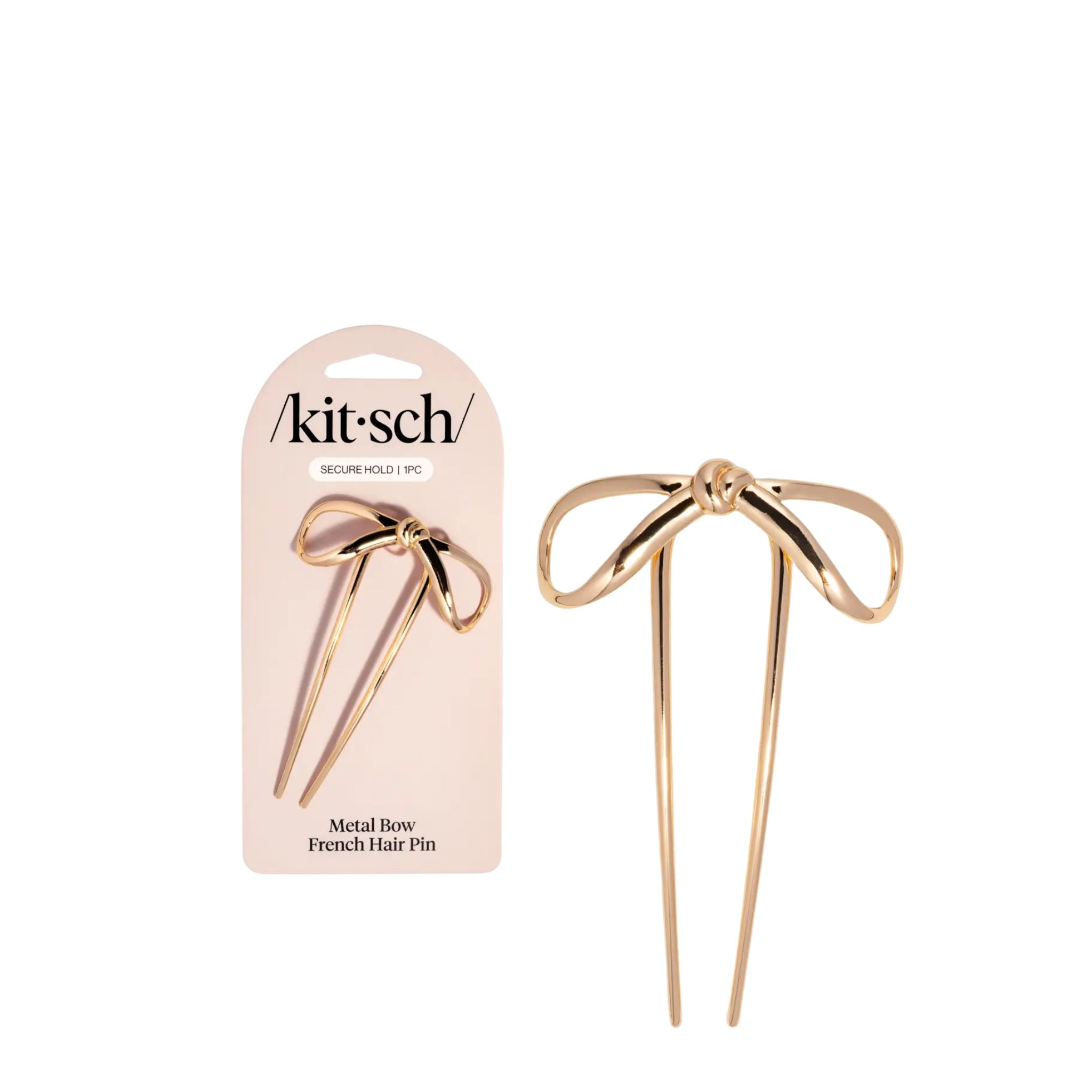 Gold metal bow French hair pin with 'kitsch' packaging on a white background
