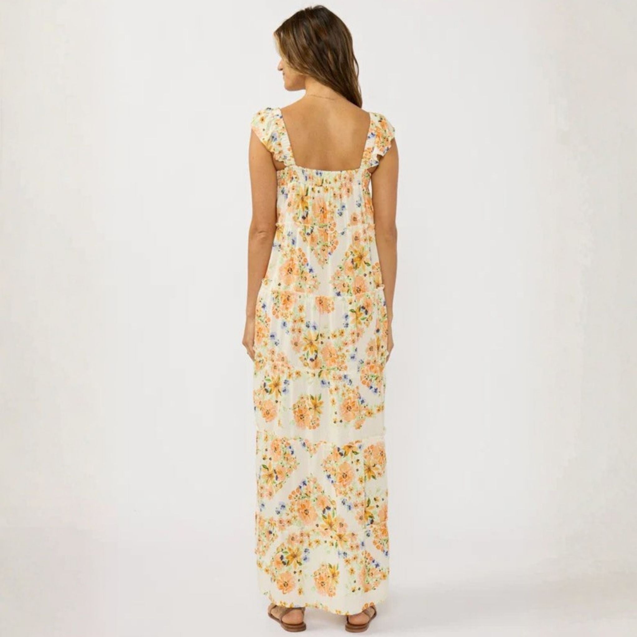 Woman wearing a floral dress on a white background