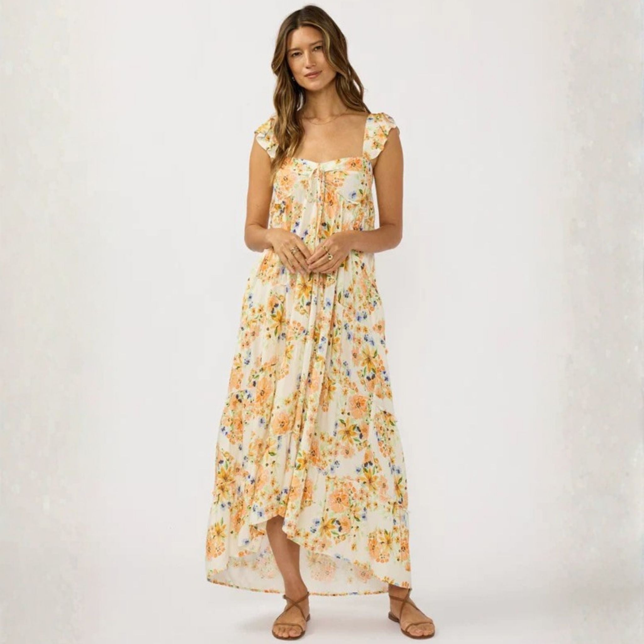 Woman wearing a floral dress on a white background