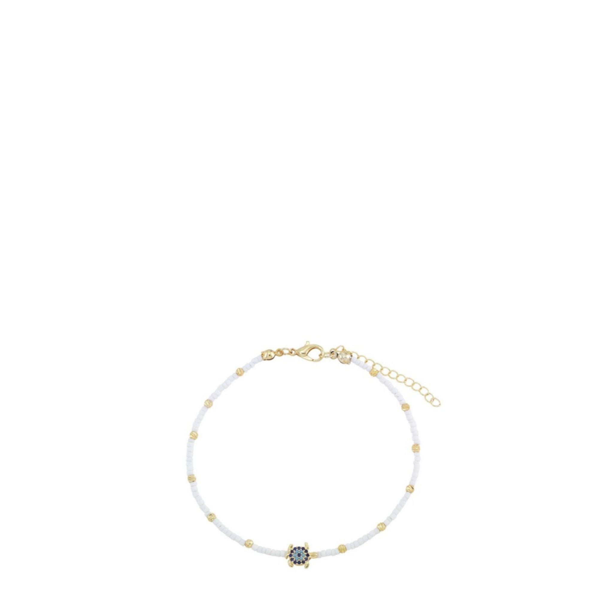 Delicate necklace with white beads and a small dark gemstone on a white background