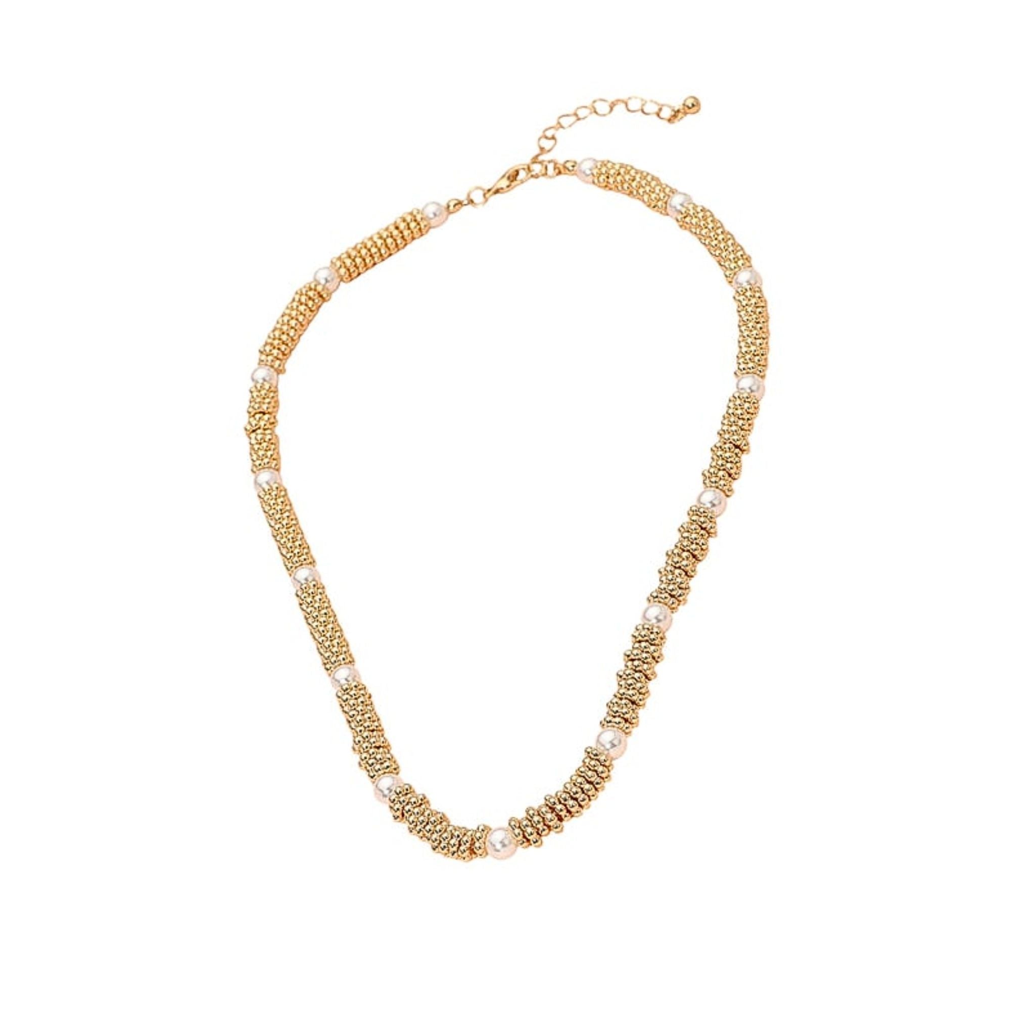Gold beaded necklace on a white background