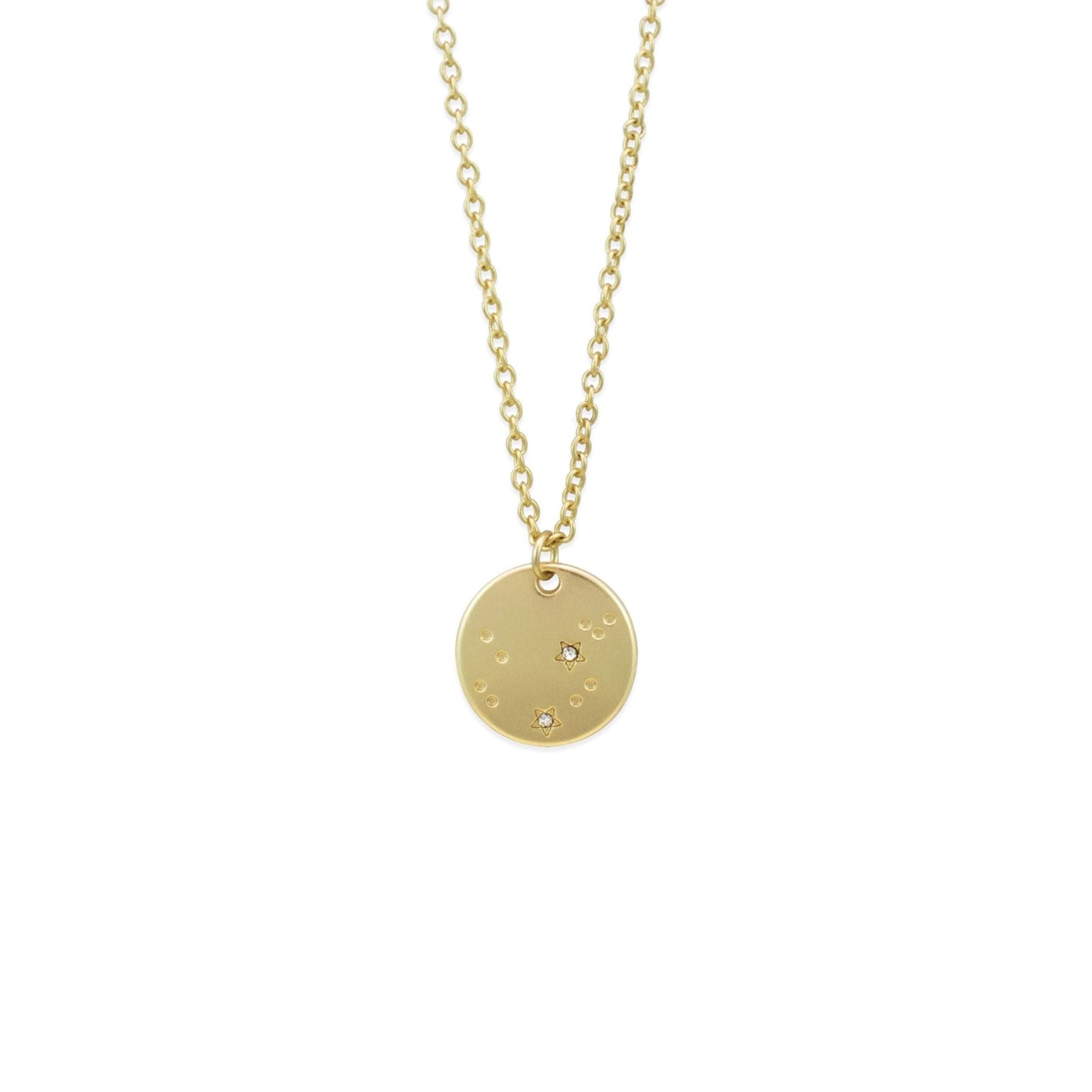 Gold necklace with a round pendant on a white background