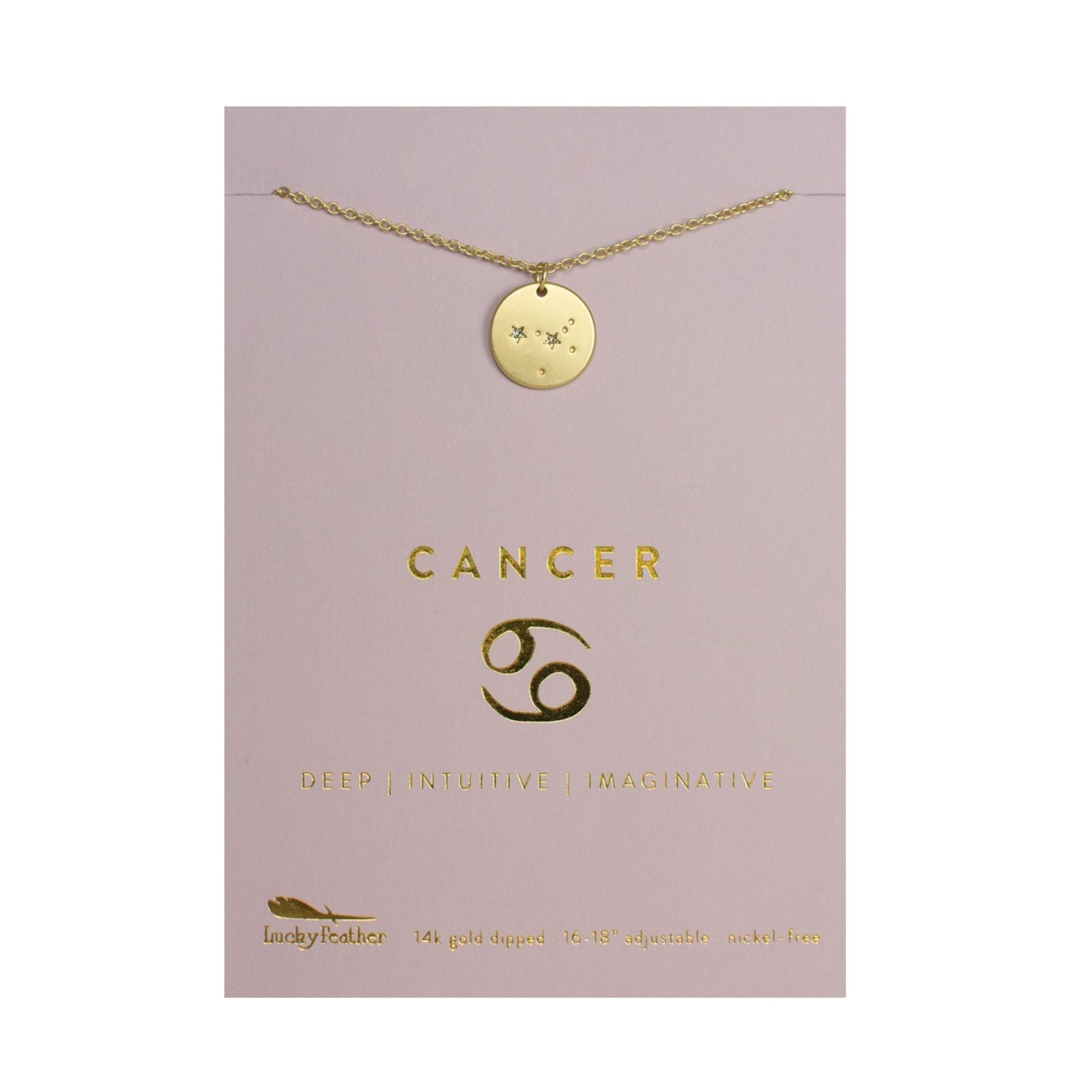 Gold necklace with Cancer zodiac symbol on a pink card