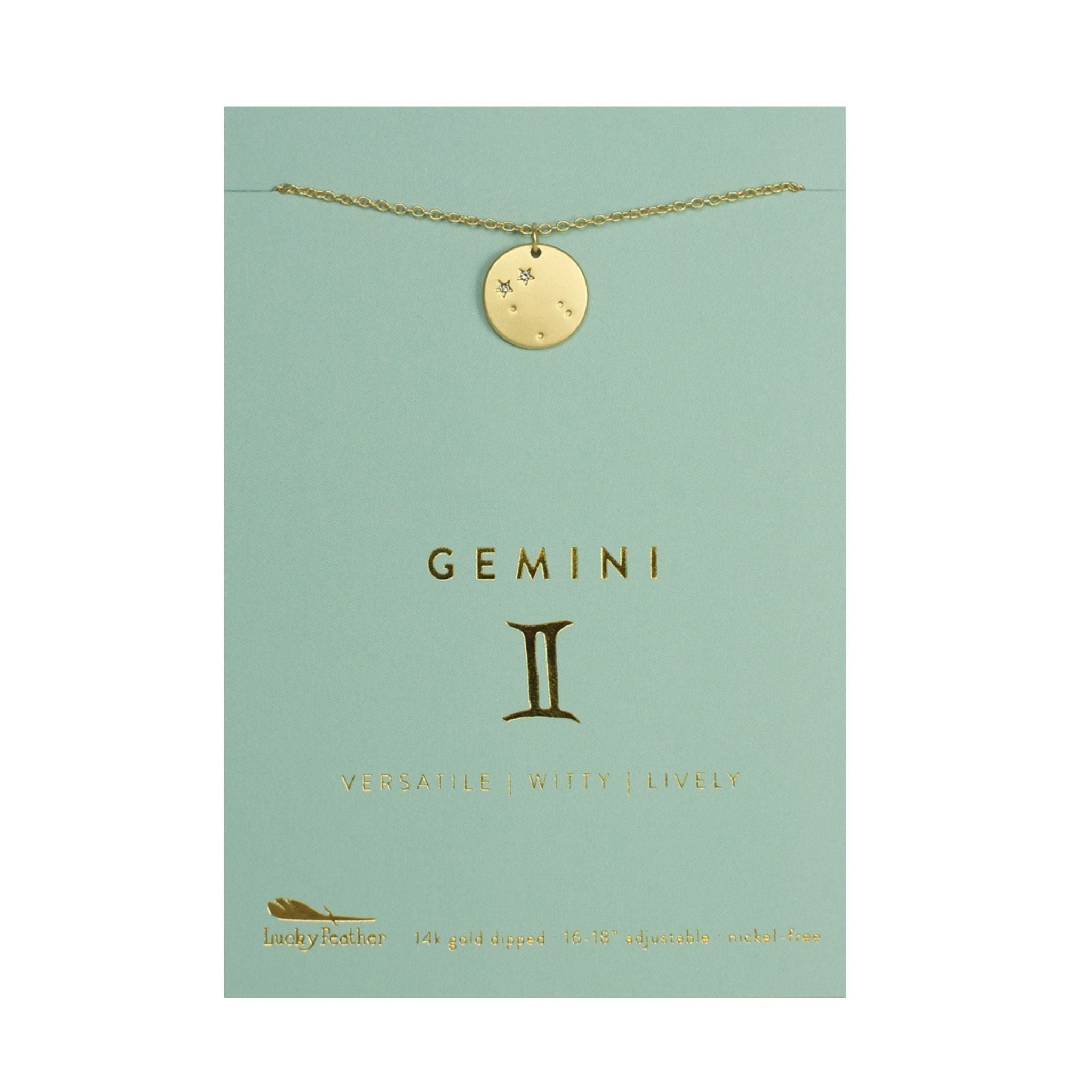 Gold necklace with a round pendant on a 'GEMINI' branded card