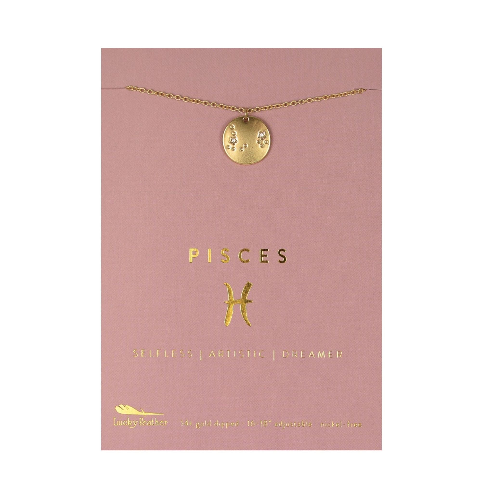 Gold Pisces necklace on a pink card with zodiac symbols