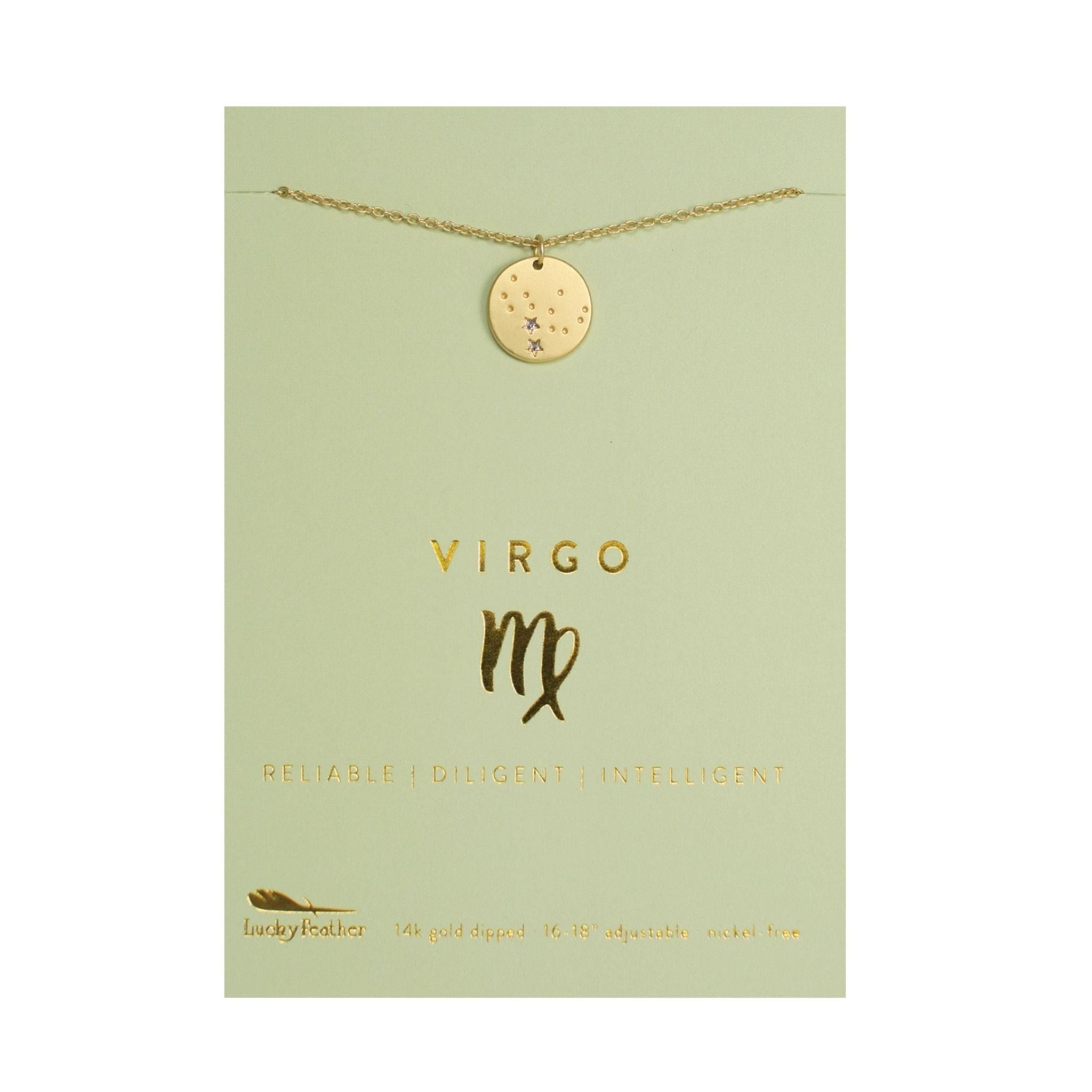 Gold necklace with Virgo pendant on a green card
